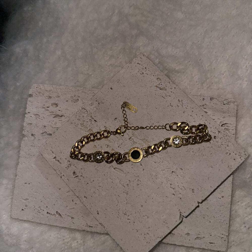 Stainless steel gold overlay Black Onyx Roman numeral braclet